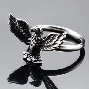 Punk style stainless steel eagle ring with spreading wings and detailed silver feathers