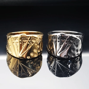 Detail of gold and silver poker royal flush relief on stainless steel rings