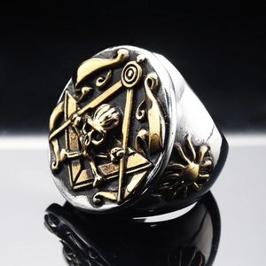 Detail of vintage Masonic skull ring with silver and gold stainless steel finish