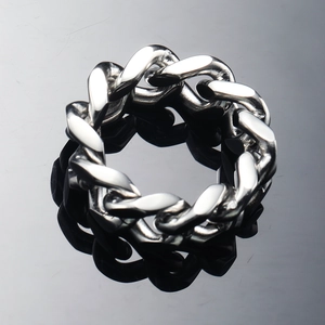 Detailed view of hollow mechanical cuban chain link ring with polished steel finish