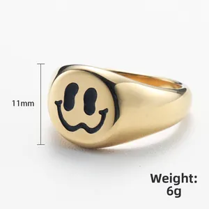 Golden smiley face stainless steel ring with 11mm width and 6g weight on white base