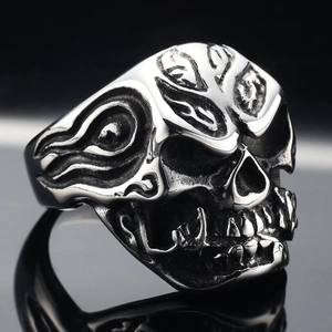 Punk silver stainless steel skull ring with flame and rose details in 45-degree view