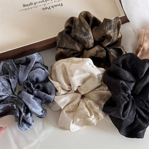 Chinese retro ink tie-dye scrunchies set in glossy silk fabric and neutral earth tones
