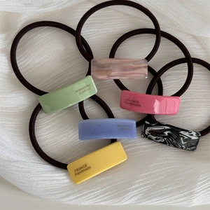 Set of 6 colorful acetate hair ties with France Handmade text on ripple fabric