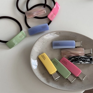 Colorful macaron acetate hair clips and elastics set in pastel mint and purple tones