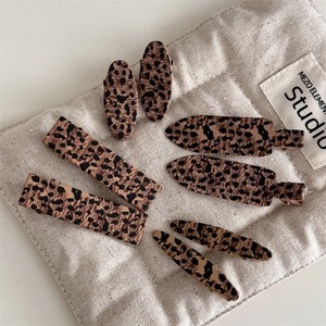 8-piece leopard print hair clip set with matte finish and varied geometric shapes