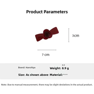Detail view of red rose acetate hair clip with 7x3cm dimensions and 8.9g weight