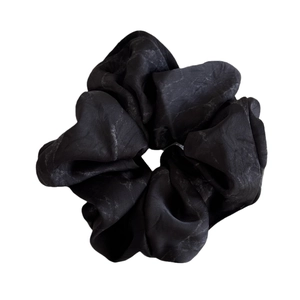Elegant satin scrunchie with black ink marble texture for a chic ponytail hairstyle