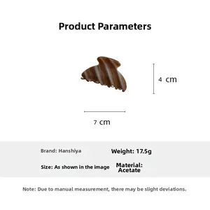 Detail view of acetate hair claw showing dimensions 7cm by 4cm and weight 17.5g