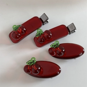 Set of four red acrylic cherry hair clips with rectangle and oval shapes for women