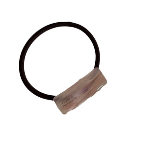 Elegant black elastic hair tie featuring a rectangular handmade acetate decorative element