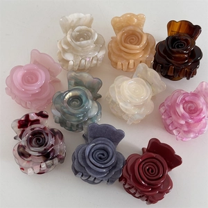 Elegantes pinzas de pelo con forma de flor de acetato en varios colores jaspeados