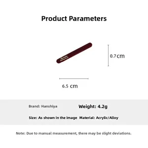 Detail showing deep red acrylic hair clip with white Barrette La France lettering