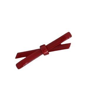 Elegant deep red acetate bow hair clip with a glossy finish for French style