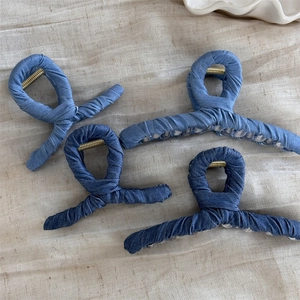 Set of 4 denim fabric wrapped shark hair claws in dark and light blue for casual styling