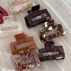 Elegant rectangle acetate hair claw clips in various tortoiseshell patterns and colors