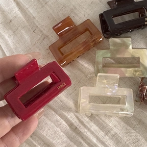 Elegant rectangle acetate hair claw clips in marble and amber colors for women