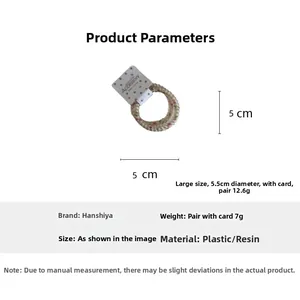 Detailed view of candy color polka dot hair coil with measurement of 5cm diameter