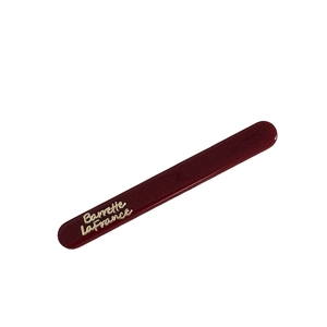 Elegant deep red Barrette LaFrance hair clip with golden lettering on white background