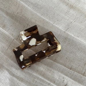 Detail of tortoise shell acetate hair claw clip with France Handmade gold lettering