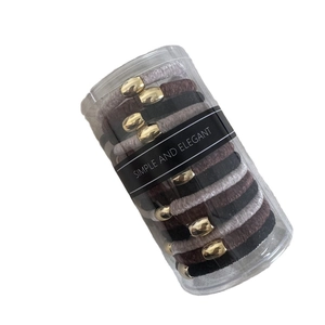 Elastic knit hair ties with gold metal buckles in a cylinder box, black and grey tones