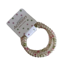 Pastel floral spiral phone wire hair tie with decorative retail display card