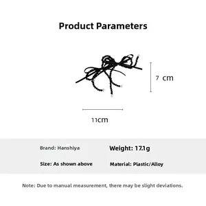 Detail showing dimensions of a black beaded bow hair clip with pearls on a white background