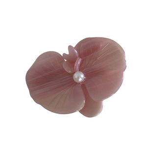 Elegant 3D orchid flower hair clip in pale pink acetate finish with a central white pearl inlay