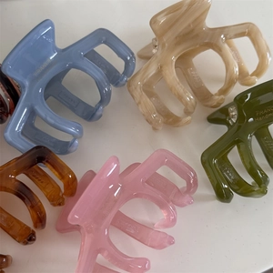 Assorted jelly color acetate hair claws in gray, beige and marble brown for women