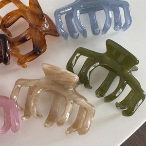 Elegant jelly-colored acetate hair claws set in amber, blue, green, beige and pink
