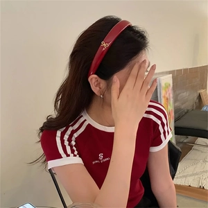 Polished wine red headband with small gold metal bow for festive and daily occasions