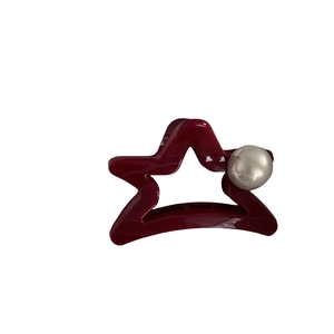 Star shaped dark red hair claw clip with pearl accent for elegant hair styling