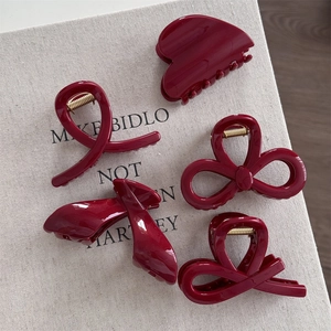 Deep wine red hair claw clips with gold glitter and elegant acrylic bow heart designs