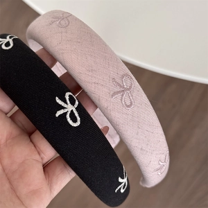 Padded sponge headband with bow embroidery in black and purple colors for women