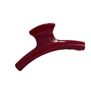Glossy deep red shark hair claw clip for elegant updo hairstyles on a white background