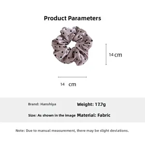 Detailed size view of lavender satin scrunchie with black heart pattern measuring 14cm