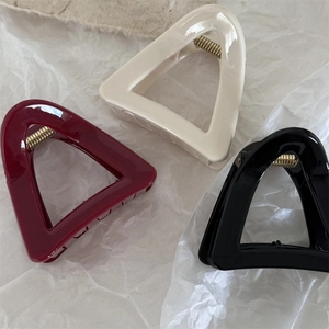 Three-piece set of triangle hair claws in cream, wine red, and black with gold springs