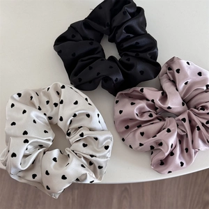 Set of 3 elegant heart pattern satin scrunchies in black, white, and soft pink