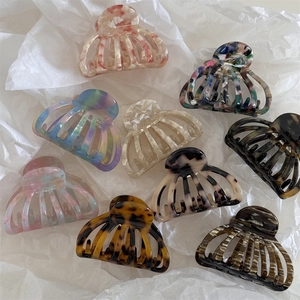 Hollow seashell acetate hair claw clips in various tortoiseshell and marble patterns