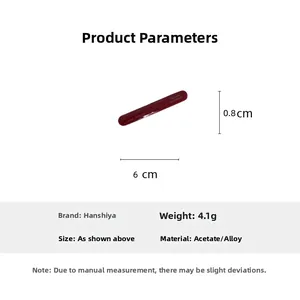 Detailed view of dark red acetate barrette hair clip measuring 6cm with gold lettering