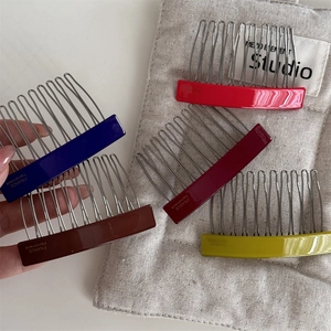 Detail of colorful acetate hair combs with durable silver metal teeth for elegant styling