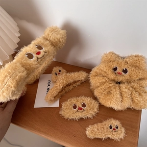 Detailed plush hair accessory set in honey butter color featuring cute cartoon embroidery
