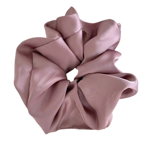 Elegant oversized satin scrunchie in dusty rose pink with a soft silky texture