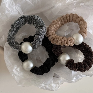 Set of four shiny fabric scrunchies with large pearls in silver, gold, black and coffee