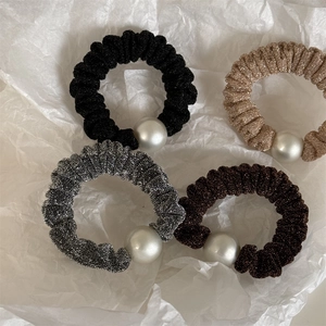 Set of four shimmering knit hair scrunchies with large faux pearl accents in neutral tones