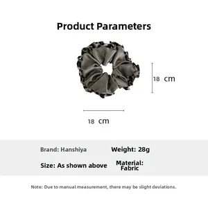 Detail of leopard print trim scrunchie showing 18cm diameter and grey satin fabric
