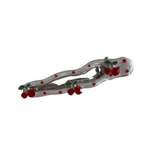 Elegant wavy silver hair clip with white enamel and sparkling red rhinestone cherries