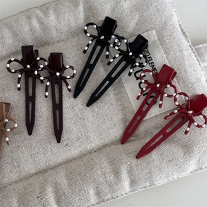 Fermagli per capelli a fiocco rétro con pois bianchi in marrone, nero e rosso