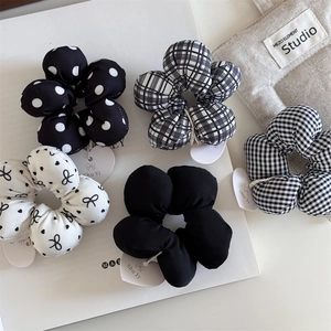 Five-piece set of black and white floral scrunchies with polka dots and plaid patterns