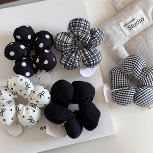 5-piece set of black and white floral hair ties with polka dots and plaid patterns